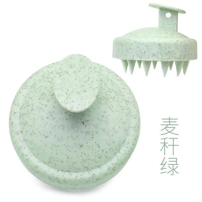 Silicone scalp massage brush comb in a green color, designed for head massages and hair care.